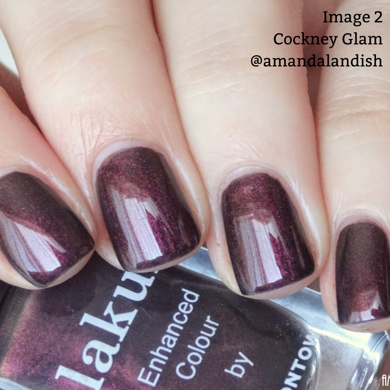 Close-up of a hand with short fingernails painted in a glossy, dark red metallic crème. The text "Image 2 Cockney Glam @amandalandish" appears in the upper-right corner. A bottle of LONDONTOWN's vegan, cruelty-free polish Cockney Glam, certified by PETA, is partially visible.