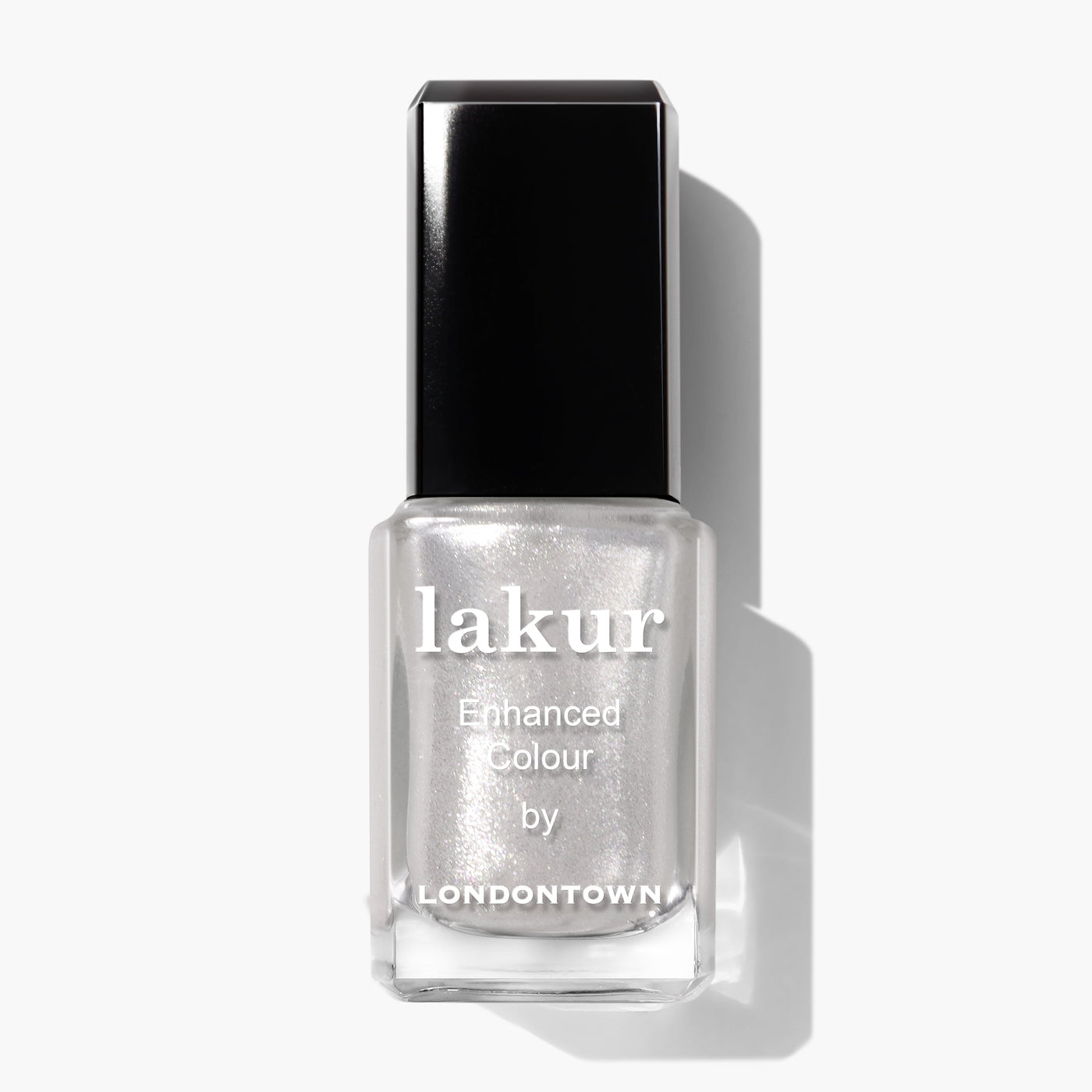 A bottle of "Coconut Crush (Professional)" by LONDONTOWN nail polish with a silver metallic finish and ultrafine glitter, featuring a black cap and clear rectangular bottle.