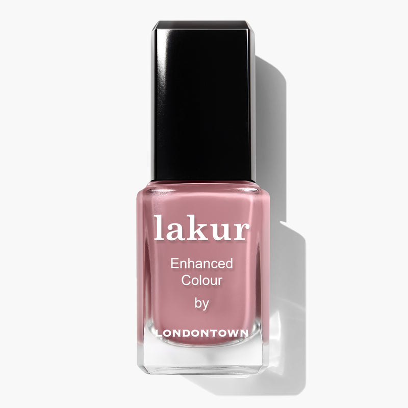 A bottle of "Crowning Crumpet by LONDONTOWN" cruelty-free nail polish with a pink shade and a black cap.