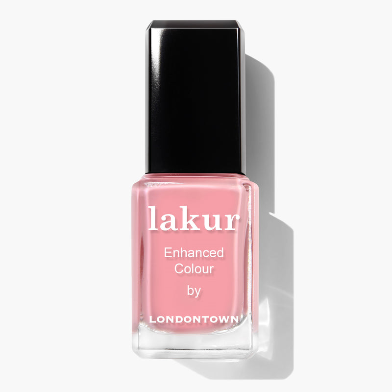 A bottle of LONDONTOWN's vegan cruelty-free lakur enhanced color nail polish in the stunning Desert Flower shade with a black cap.