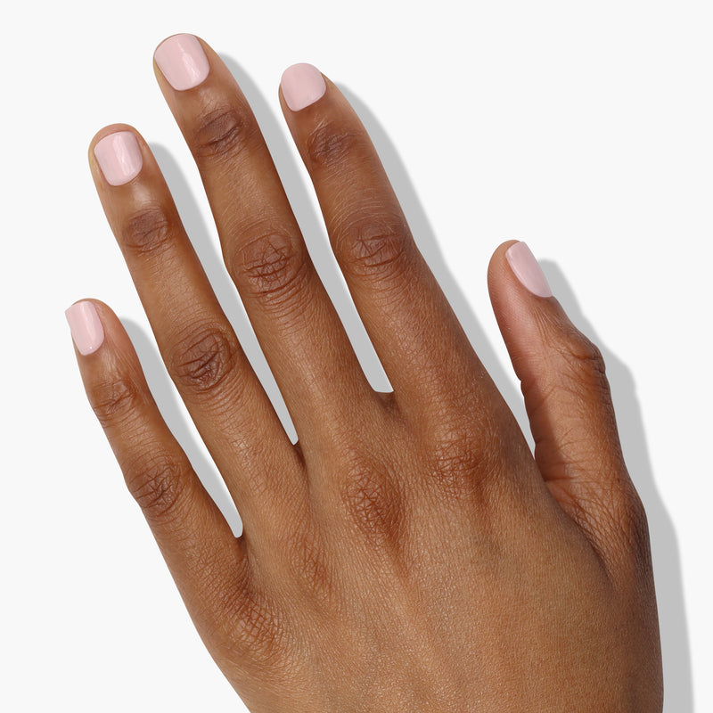 A hand with nails polished in LONDONTOWN's Dream Scene, displayed against an alabaster white background.