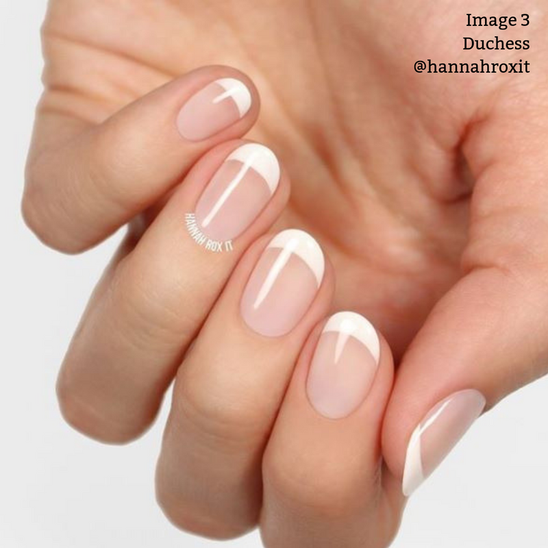 Close-up of a hand showing a French manicure with LONDONTOWN's Duchess natural pink nail polish and pure crème white tips. Text in the top right reads "Image 3 Duchess @hannahroxit".