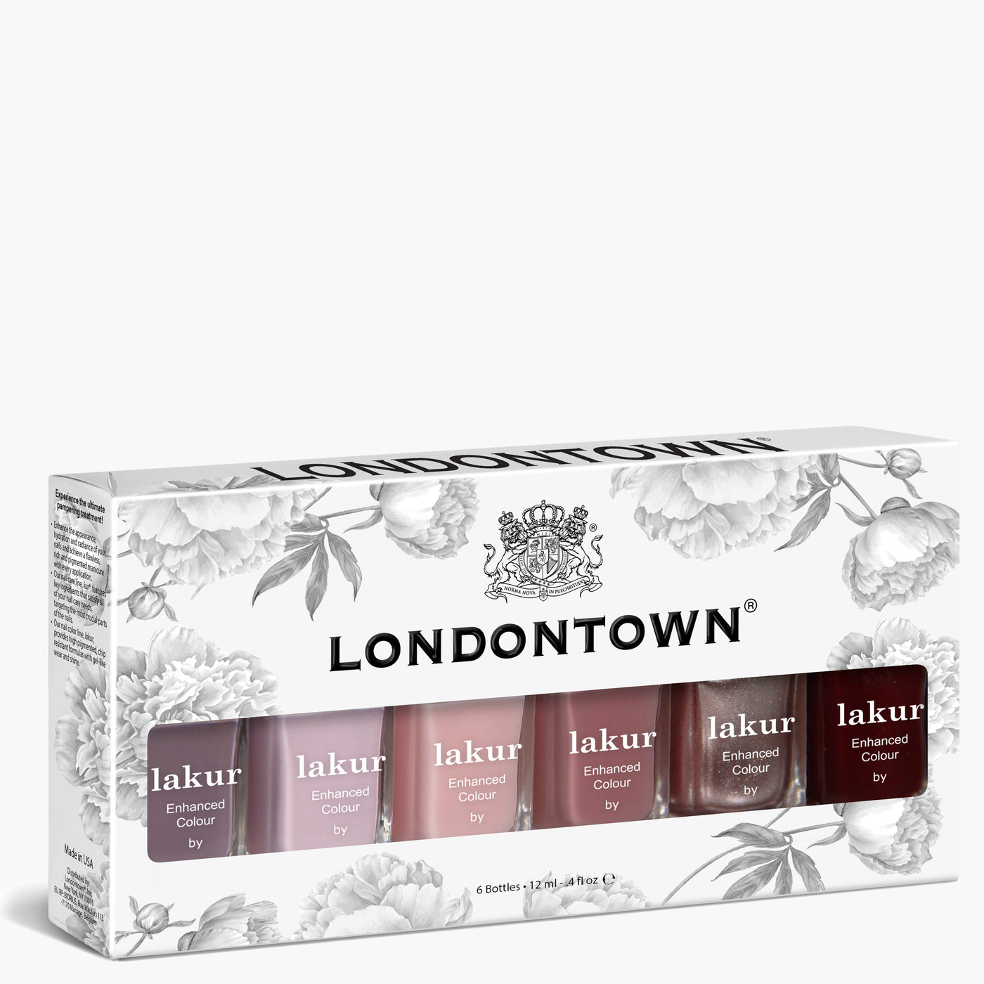 The LONDONTOWN Essential Palette features six Lakur nail polishes in pink, red, and classic neutral shades, all elegantly packaged in a floral-patterned white box.