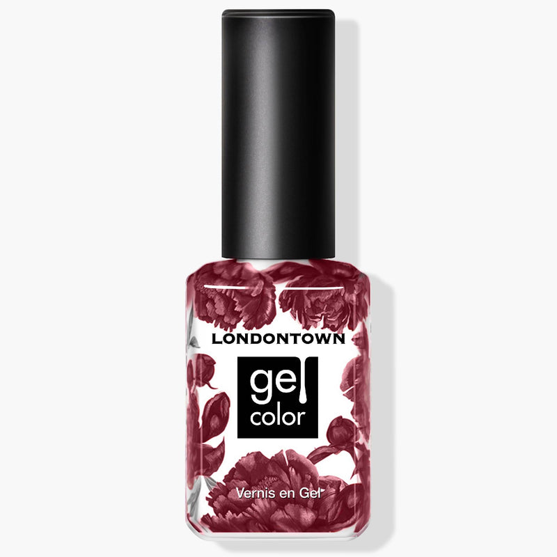 A bottle of LONDONTOWN's gel color nail polish, named "Fig Jam," features a black cap and a floral patterned label. The shade is reminiscent of fig preserve, offering a rich and ripened mauve-tinged purple hue.