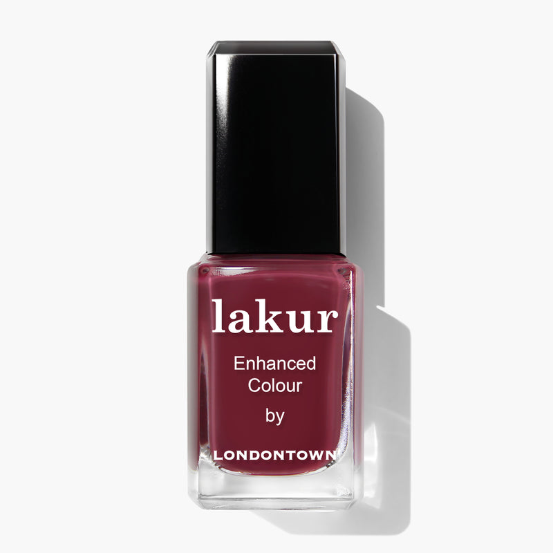 A bottle of LONDONTOWN nail polish in a deep mauve color labeled "Fig Jam.