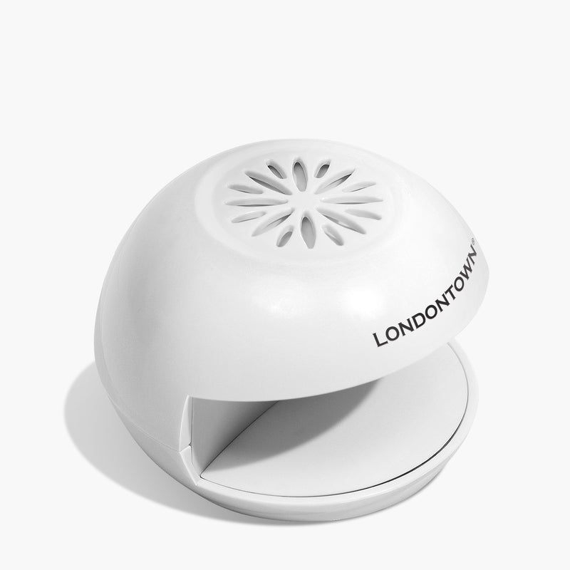 A white, dome-shaped Flash Dry Nail Fan with "LONDONTOWN" printed on it, perfect for at-home manis and on-the-go touch-ups.