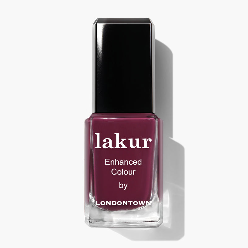 A bottle of Flirty & Thriving nail polish by LONDONTOWN, featuring a ripened raspberry maroon shade, with a black cap and clear square bottle.