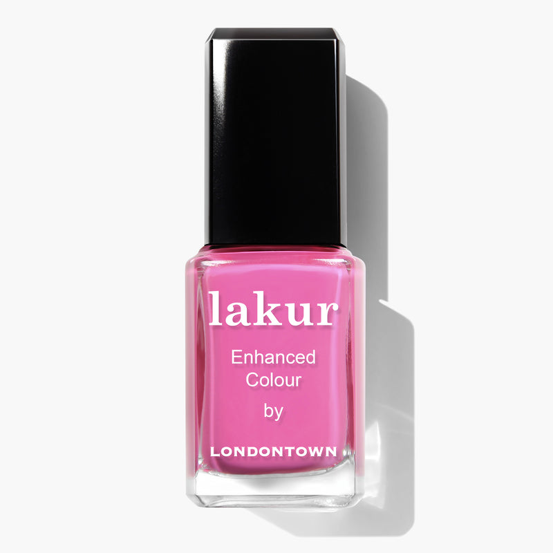 A bottle of Londontown Fruit Tella pink nail polish with a black cap, part of the vegan cruelty-free Londontown polishes collection.