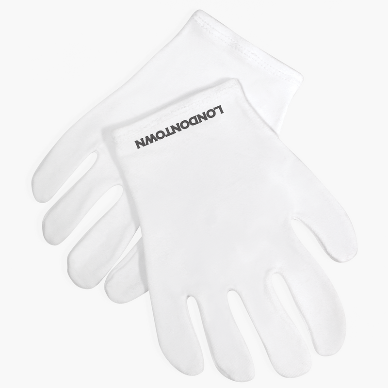 A pair of white gloves, crafted to keep hands cozy and lock in moisture, showcases the brand name "LONDONTOWN" printed in black on the wrist area of one glove. They are positioned crisscrossed against a white background.