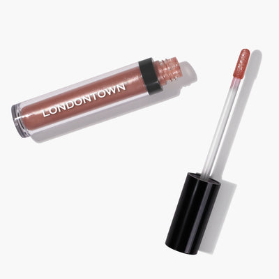 A tube of LONDONTOWN Plush Shine Lip Gloss - Gossamer with an open cap and applicator wand. The lip gloss is a shimmery peachy pink shade.