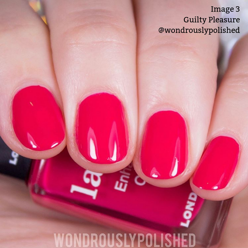 Close-up of a hand with short, manicured nails painted in a glossy, bright pink polish. A bottle of the same formaldehyde-free nail polish is partially visible in the background. Text reads "Image 3 Guilty Pleasure @LONDONTOWN".