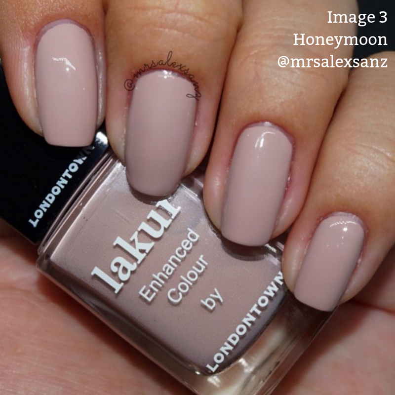 A close-up of a hand showcases nails painted in a light mauve shade, holding a bottle of Lakur nail polish prominently labeled "Honeymoon" and "Enhanced Colour by LONDONTOWN." This cruelty-free and vegan nail polish epitomizes elegance. Text in the image reads "Image 3 Honeymoon @mrsalexsanz".