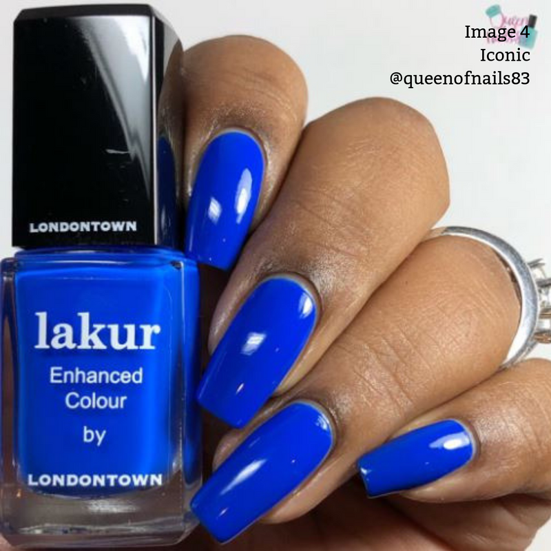 A hand with long, neatly manicured nails painted in a bright electric blue color holds a bottle of blue nail polish labeled "Iconic by LONDONTOWN." Text on the image reads, "Image 4 Iconic @queenofnails83," showcasing the 2019 Allure Best of Beauty Award winner.