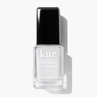 A bottle of LONDONTOWN Illuminating Nail Concealer, perfect for brightening dull nails and concealing discoloration, featuring a black cap on a white background.