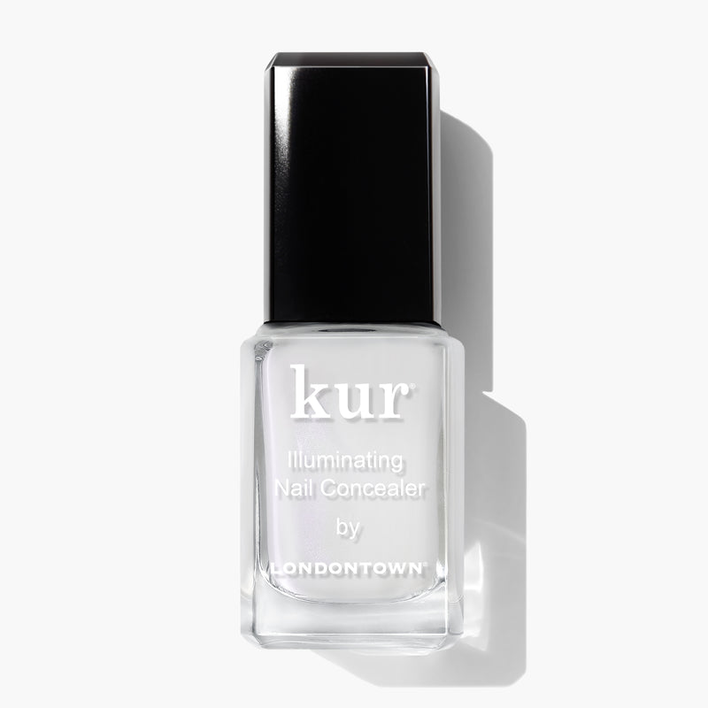 A bottle of LONDONTOWN Illuminating Nail Concealer, perfect for brightening dull nails and concealing discoloration, featuring a black cap on a white background.