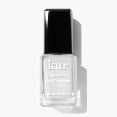 A bottle of LONDONTOWN Illuminating Nail Concealer (Professional), ideal for brightening dull nails, featuring a black cap and displayed against a white background.