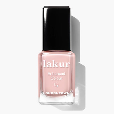 A bottle of LONDONTOWN's Invisible Crown (Professional) sheer pink nail polish, designed with a black cap and white lettering, offers an invisible crown of elegance.