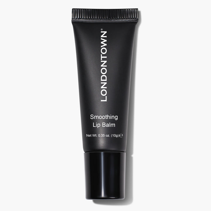 A black tube of Smoothing Lip Balm from LONDONTOWN, featuring white text indicating its name and net weight of 10 grams (0.35 oz), provides an ultra-rich, conditioning lip treatment.