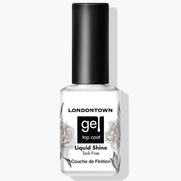 A white bottle of LONDONTOWN Liquid Shine Tack-Free Top Coat, featuring a black cap and adorned with a floral design on the label, promises a superior gloss shield.