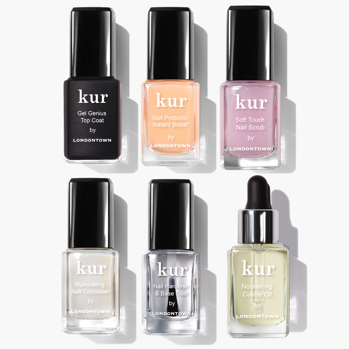 The Londontown Total Care Set from LONDONTOWN includes six expertly curated nail care products, arranged in two rows, each designed for your nail perfection. The set features a top coat, probiotic boost, nail scrub, nail concealer, base coat, and cuticle oil to ensure your nails are always polished and prepped.