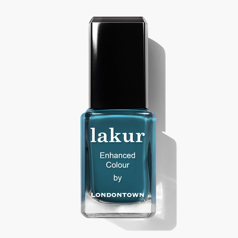 A bottle of LONDONTOWN's lakur nail polish in the shade Magpie, with the label reading "Enhanced Colour." The bottle, making a sophisticated statement, has a black cap and is displayed against a white background.