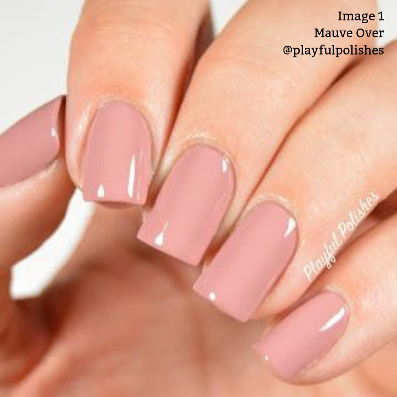 Close-up of a hand with freshly manicured nails painted in a glossy mauve color. The text in the image reads "Image 1 Mauve Over @playfulpolishes." This vegan, cruelty-free soft crème nail polish from LONDONTOWN adds an elegant touch.