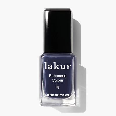 A bottle of deep indigo "Midnight Kiss (Professional)" nail polish by LONDONTOWN with a black cap, viewed from the front.
