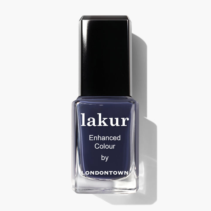 Bottle of Midnight Kiss nail polish by LONDONTOWN in a deep, moody navy blue shade.