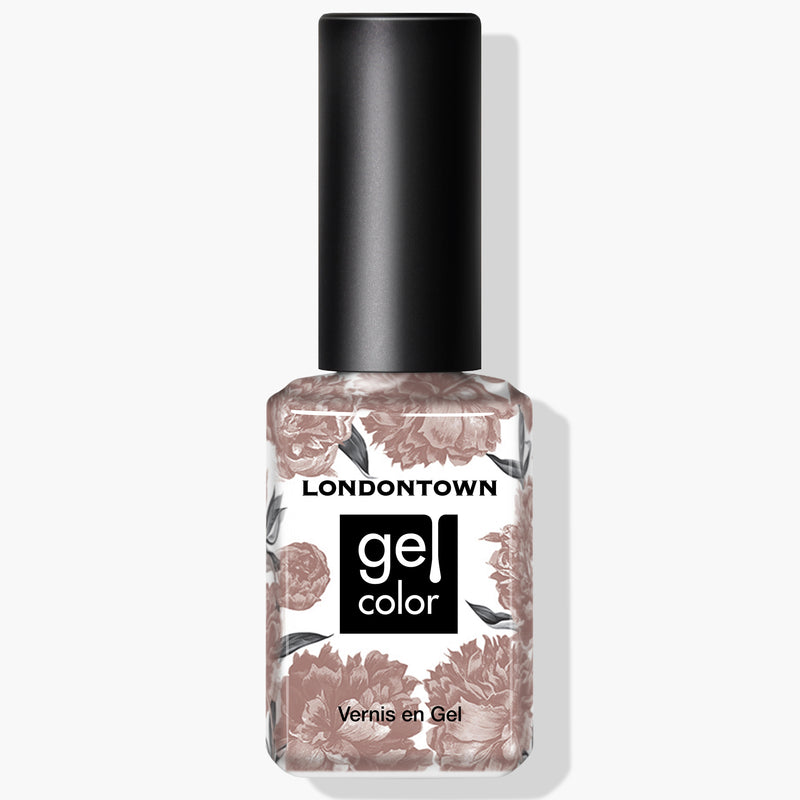 A bottle of LONDONTOWN gel nail polish named Milk Tea, with floral patterns on the label, featuring a deep nude crème shade that's vegan and cruelty-free.