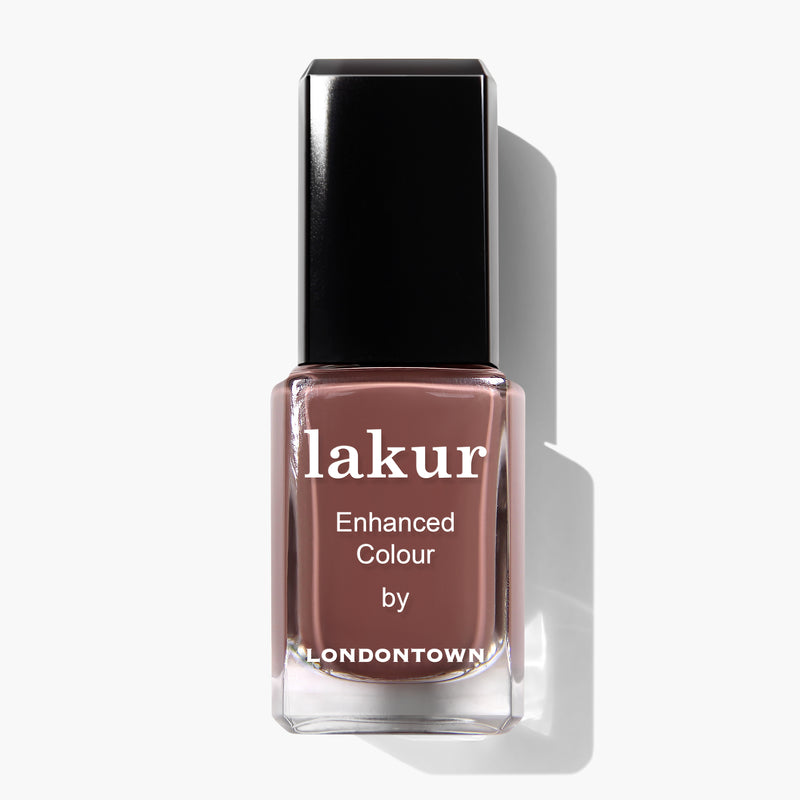 Bottle of "Mudslide" deep brown nail polish from LONDONTOWN, featuring a black cap and white text on the label. Infused with Florium Complex and vegan cruelty-free, it offers a rich hue for an elegant touch.