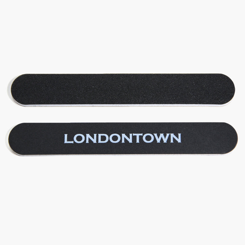 The LONDONTOWN Emery Board Nail File set includes two black, durable emery boards with rounded edges. One board features the brand name "LONDONTOWN" in white capital letters. Perfect for everyday use at home or on the go.
