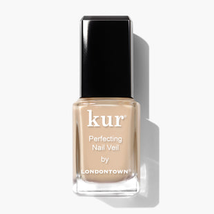 A bottle of LONDONTOWN Perfecting Nail Veil #2, featuring a beige nail polish with a black cap, delivers a power-packed blend of elegance and care. Enjoy a hint of color that perfects your nails effortlessly.