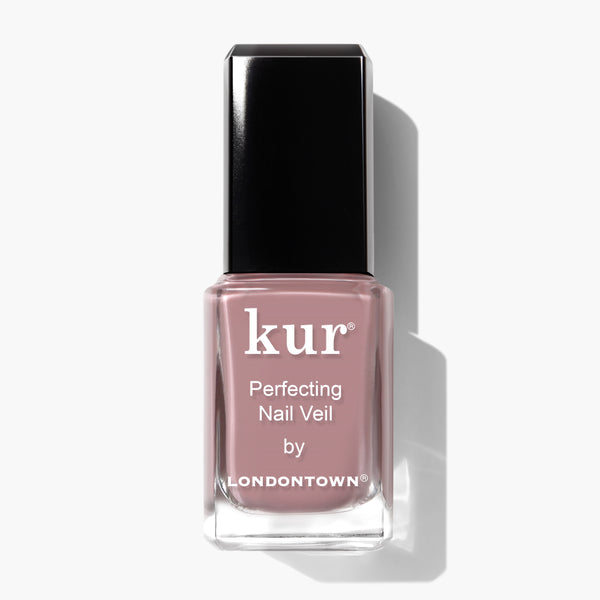 A bottle of LONDONTOWN Perfecting Nail Veil #3 in a vibrant pinkish shade, featuring a black cap, set against a plain white background.
