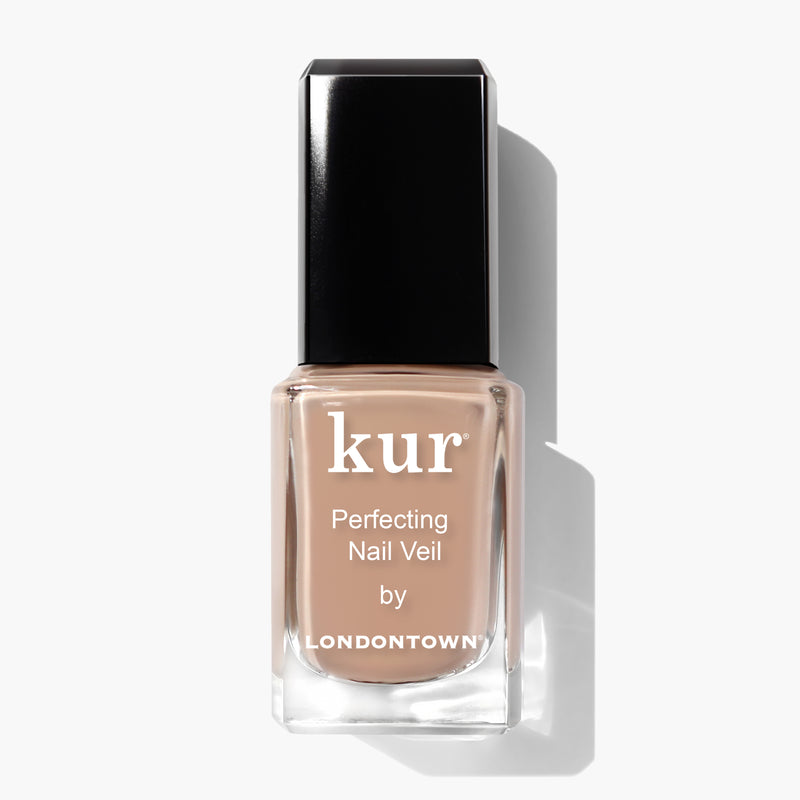 A rectangular bottle of Perfecting Nail Veil #6 by LONDONTOWN, featuring a hint of color with its nude nail polish, complemented by a black cap and white text on the label. This power-packed product offers both beauty and care for your nails.
