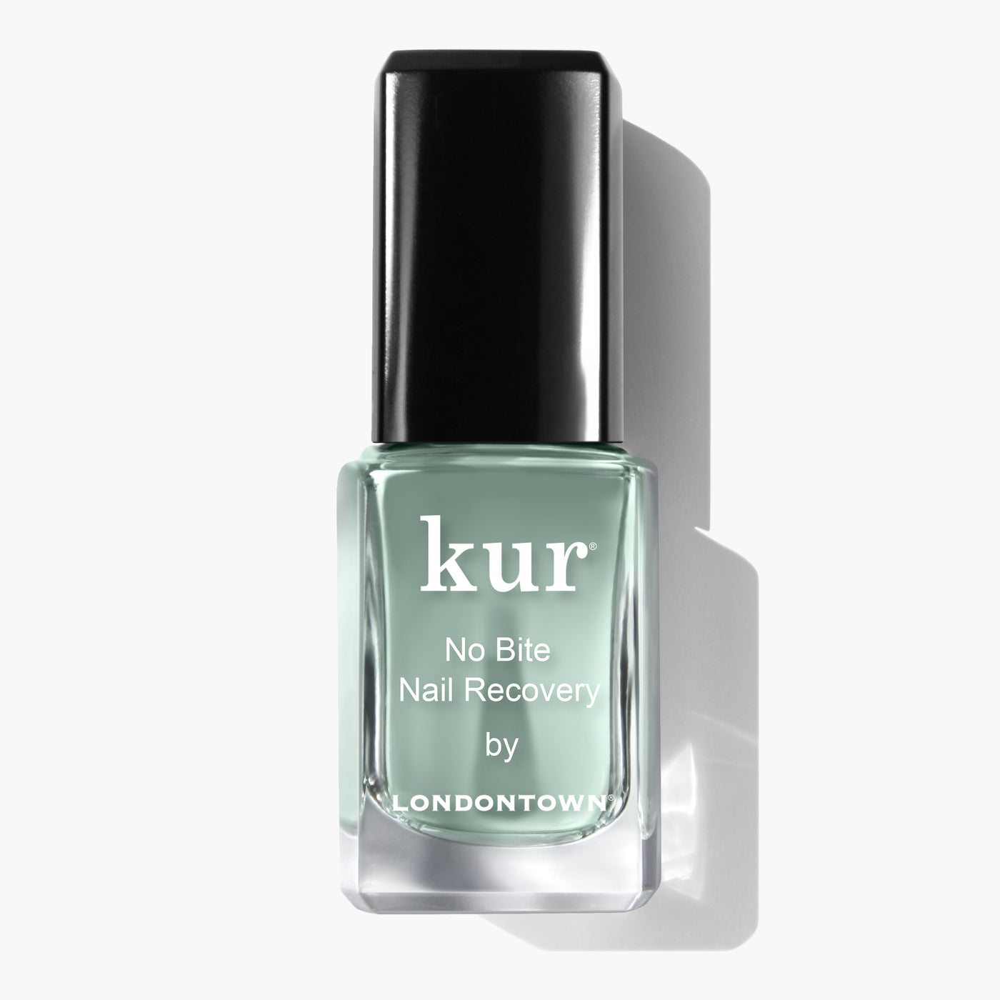 A bottle of LONDONTOWN No Bite Nail Recovery polish, featuring a black cap and green liquid inside, is designed to promote healthy-looking nails and encourage better habits.