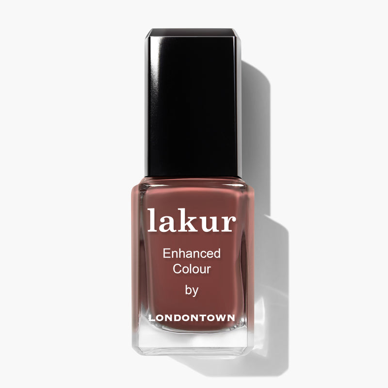A glass bottle of Oud Mood nail polish by LONDONTOWN, featuring a rich, brownish-red shade reminiscent of hot chocolate and a black cap.