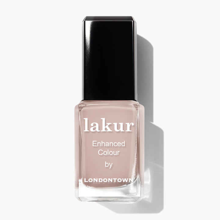 A bottle of Pampas Beige nail polish by LONDONTOWN with a black cap and a creamy beige color.