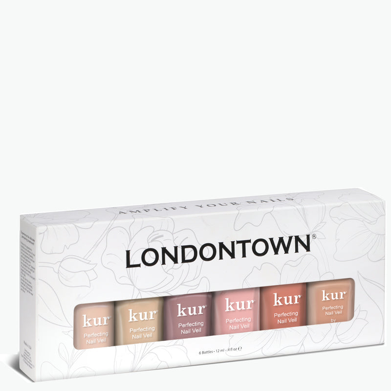 A box containing six LONDONTOWN Perfecting Nail Veil Collection nail polishes in various shades for ultimate care. The packaging features a floral design with the brand name prominently displayed in the center, making it a color essential for any manicure.
