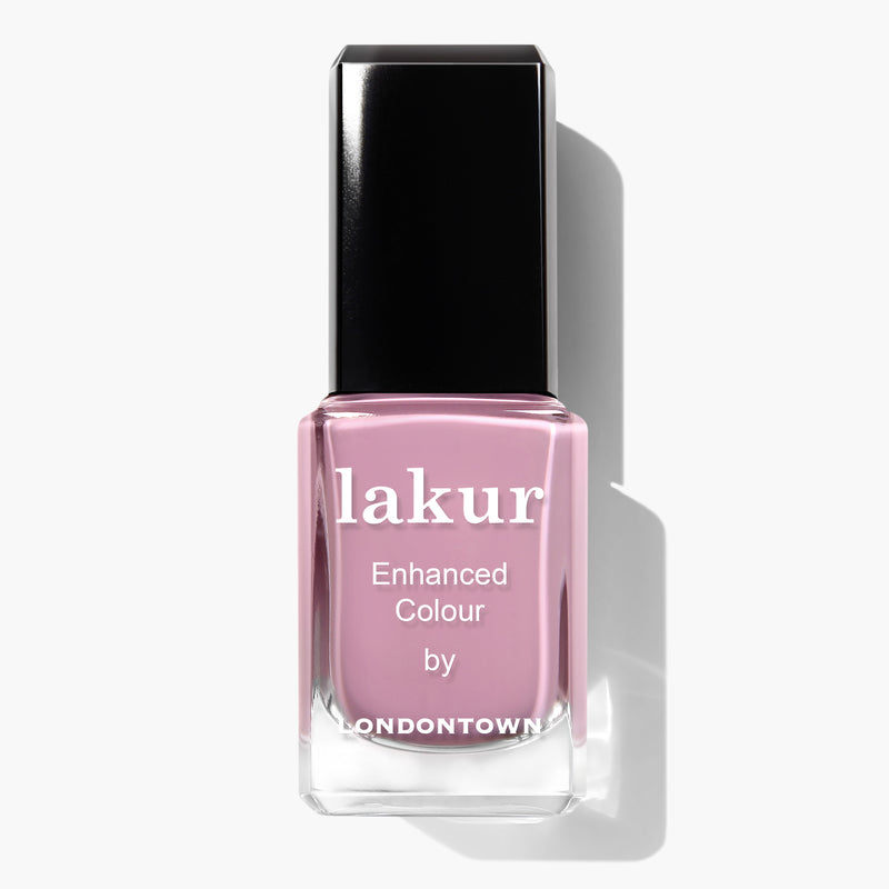 A bottle of LONDONTOWN's Plush Lakur Enhanced Colour nail polish with a black cap in a vegan, cruelty-free mauve crème shade.