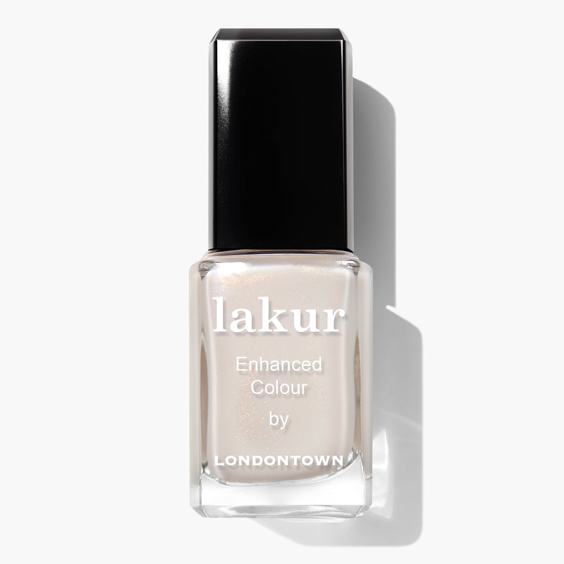 A bottle of white Princess Awaits Lakur Enhanced Colour vegan nail polish by LONDONTOWN with a black cap on a white background.