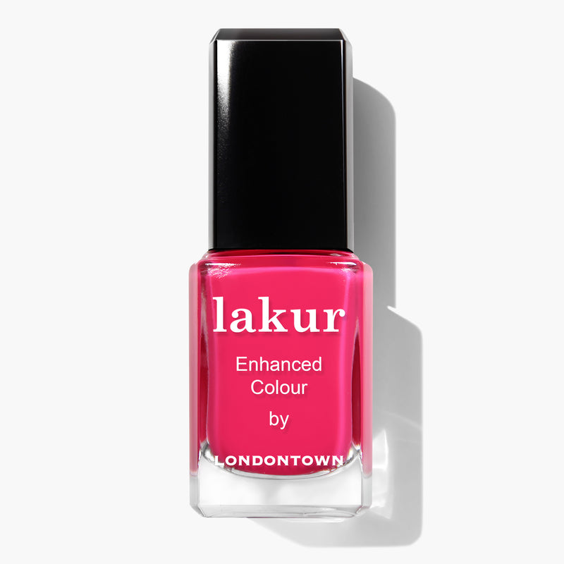 A bottle of LONDONTOWN's Queen of Hearts Lakur Enhanced Colour nail polish in a deep fuchsia pink crème shade with a black cap. This vegan, cruelty-free polish is a standout among LONDONTOWN polishes.