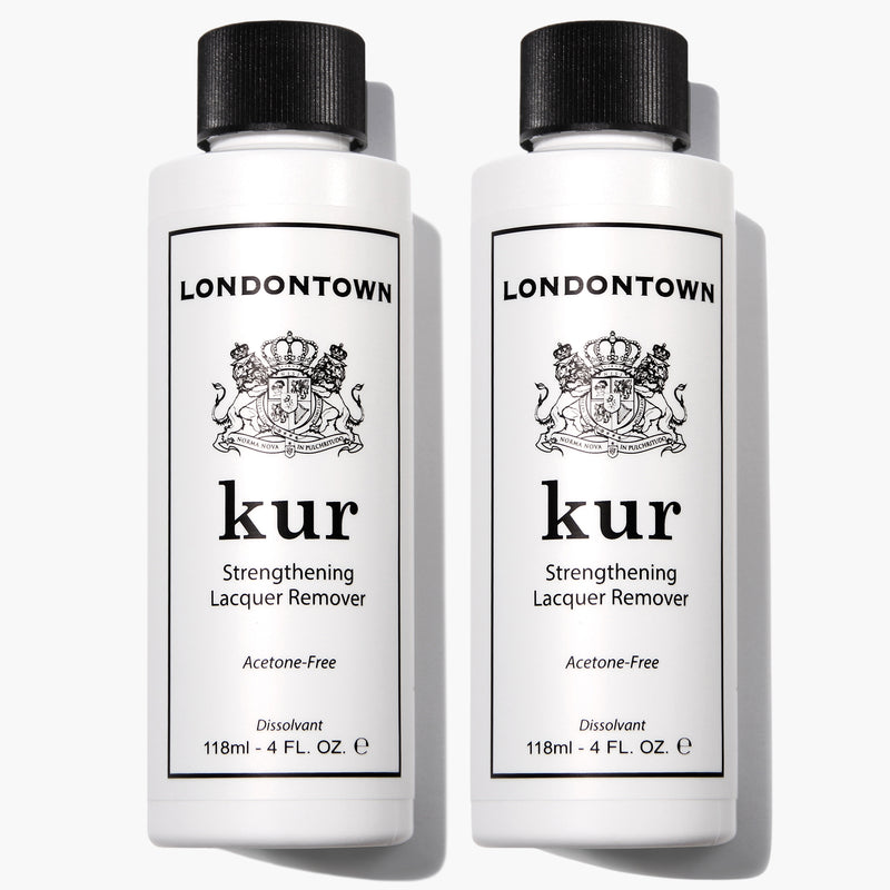 Two bottles of LONDONTOWN Strengthening Remover Duo, 118 ml each, stand upright with white labels and black caps—gently hydrating as they remove polish.
