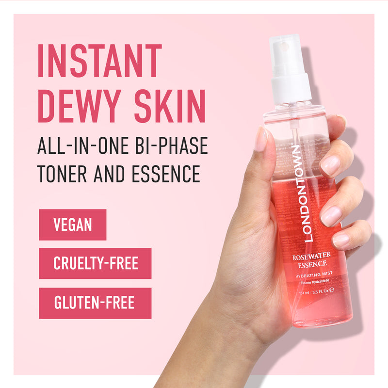A hand holding a bottle of LONDONTOWN Rosewater Essence Facial Mist. The text reads, "Instant Dewy Skin, Rose-Infused All-in-One Bi-Phase Toner and Essence, Vegan, Cruelty-Free, Gluten-Free.