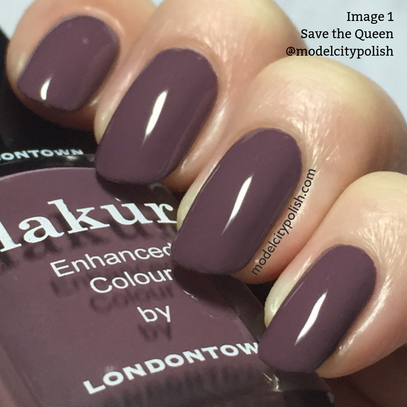 Close-up of a hand with nails painted in a dark plum shade, holding a bottle of Londontown nail polish in the same color. The text on the bottle reads "kur Enhanced Colour by LONDONTOWN," and this vegan cruelty-free formula is infused with Florium Complex for lasting quality. The shade is named "Save the Queen.