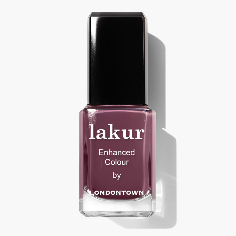 A bottle of Save the Queen Lakur Enhanced Colour nail polish by LONDONTOWN, featuring a dark mauve and plum shade with a black cap, infused with Florium Complex and proudly vegan and cruelty-free.