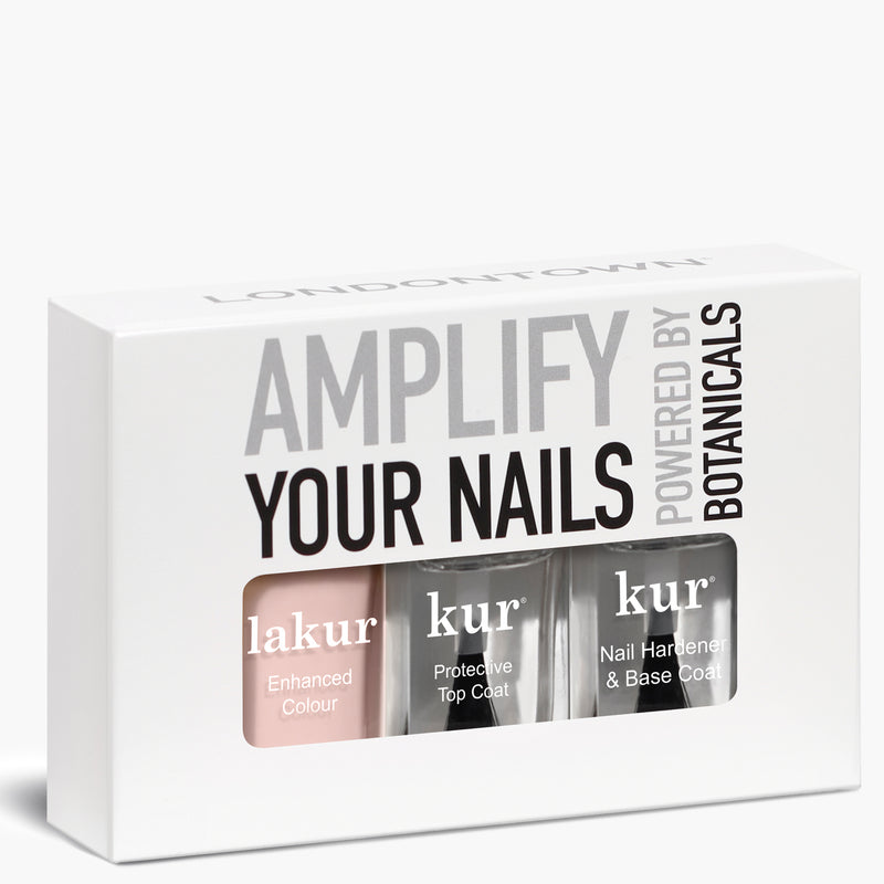 A versatile box from LONDONTOWN called "Sheer Mani" that contains three nail products with the text "AMPLIFY YOUR NAILS" on top. Perfect for weekends or work, the set includes "lakur Enhanced Colour," "kur Protective Top Coat," and "kur Nail Hardener & Base Coat.