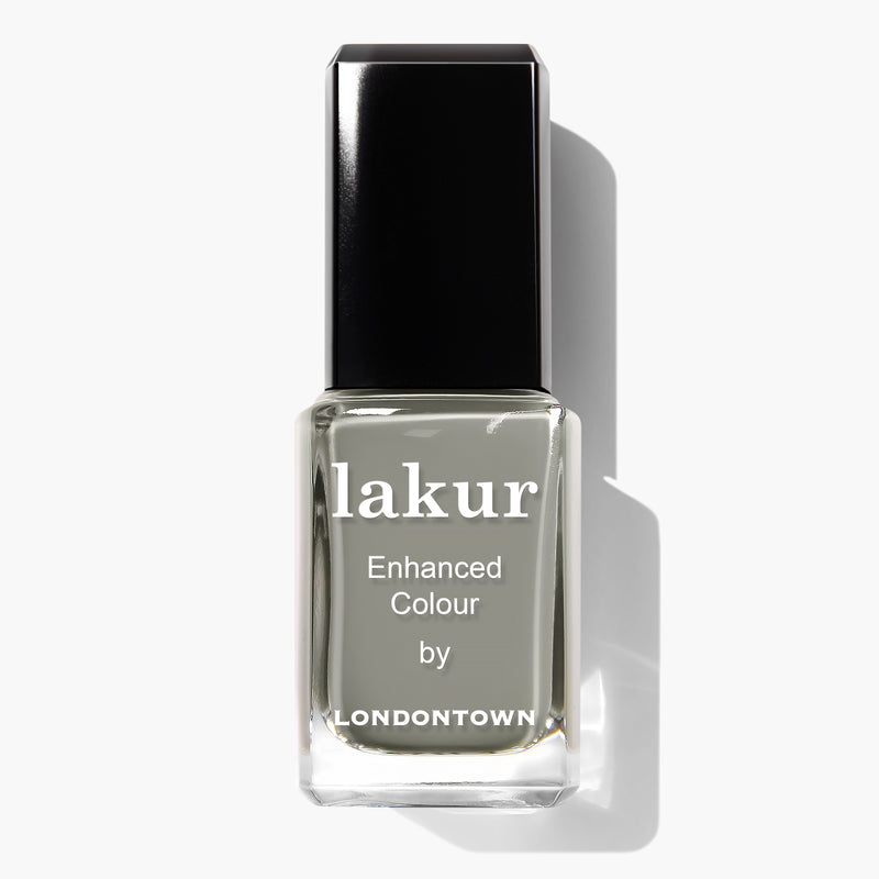 A bottle of Star Moss nail polish by LONDONTOWN in a neutral grey shade. This 16+ Free, vegan, and cruelty-free nail polish comes with a black cap and white text on the front.