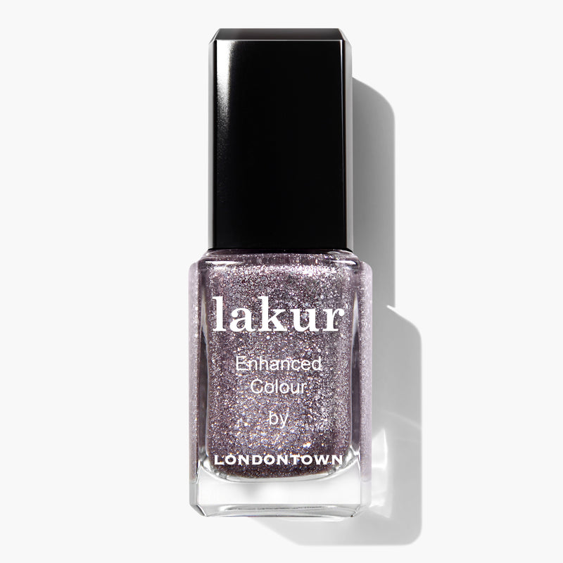 Bottle of LONDONTOWN Starstruck nail polish, a vegan and cruelty-free shimmer polish in a glittery lavender color, with a black cap and white text on the label.