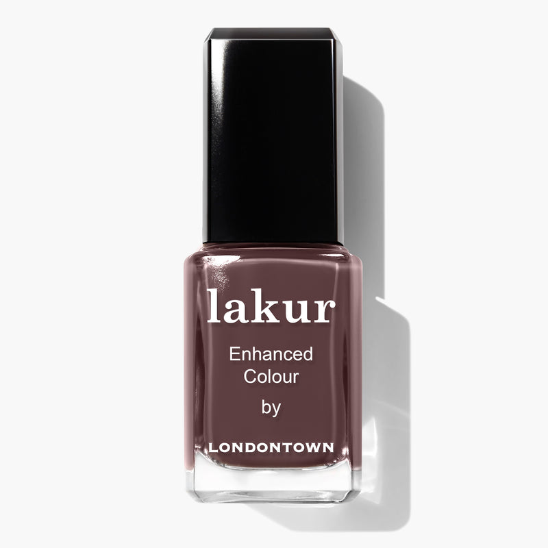 A bottle of Lakur nail polish by LONDONTOWN in the Teak shade, featuring a black cap and photographed against a white background. This vegan and cruelty-free nail polish offers a perfect blend of style and ethics.