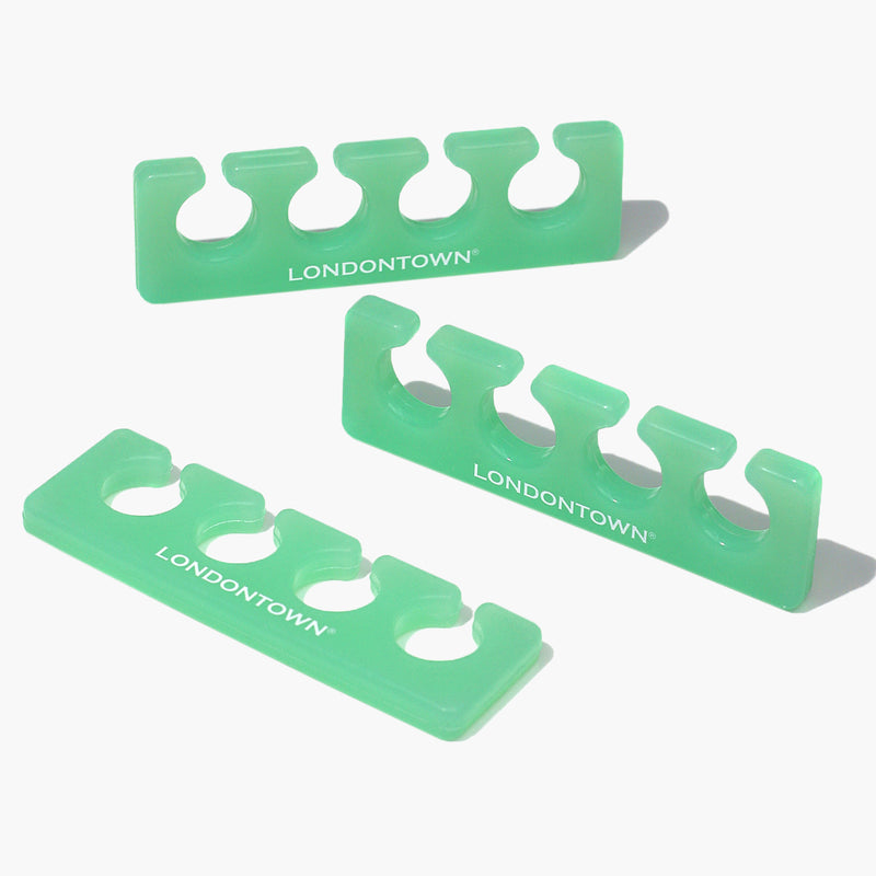 Three green LONDONTOWN Jelly Toe Separators, a must-have for mess-free pedicures, are arranged on a white background.